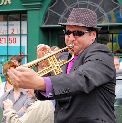 Trumpeter on one of the floats in the Jazz Parade (August 2010).
